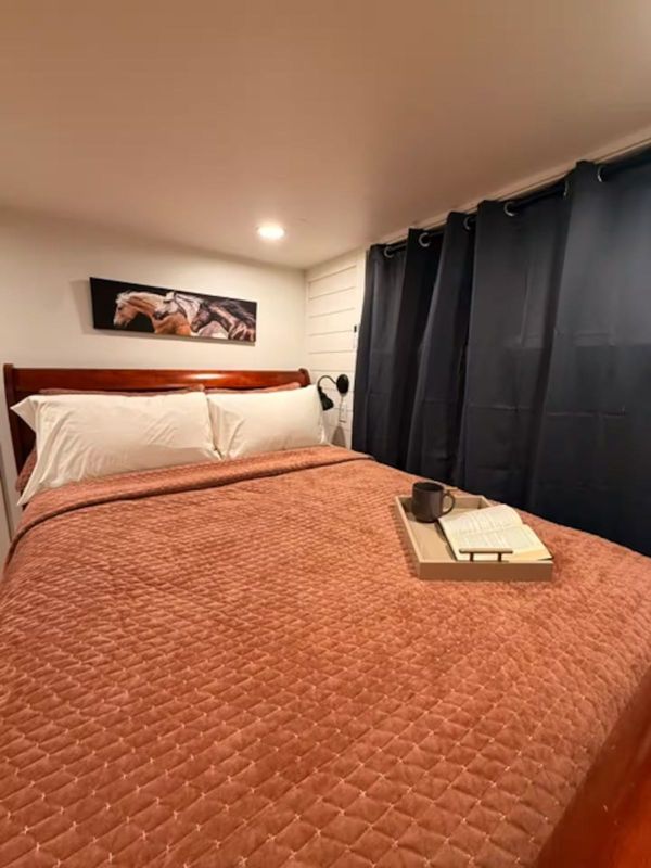 Queen bedroom on the main floor of The Waxahachie Tiny Home